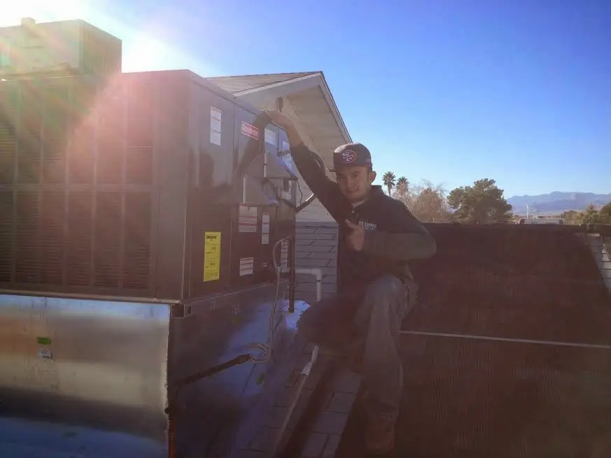 HVAC technician performing HVAC Inspection on a rooftop unit in Boiling Springs